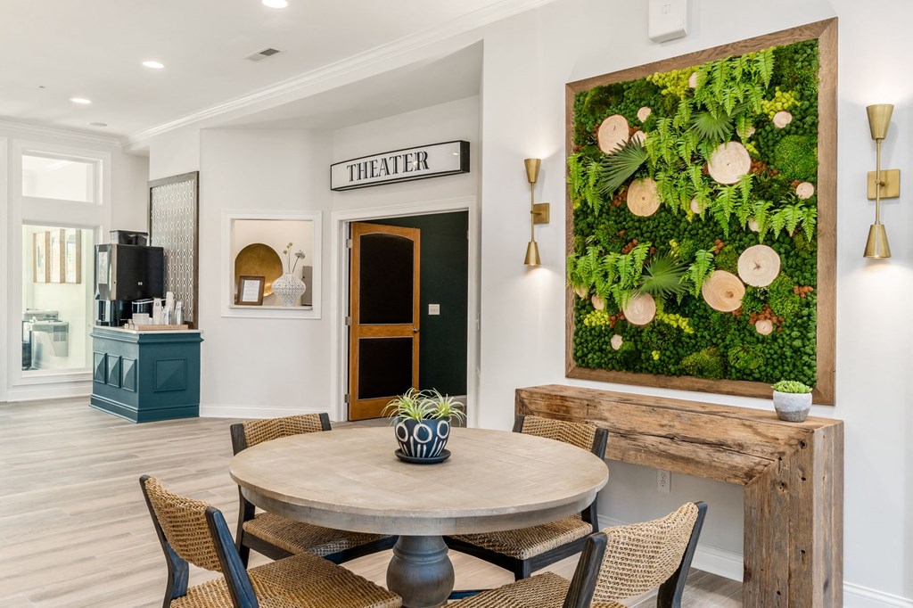 a living wall in a dining room with a table and chairs
