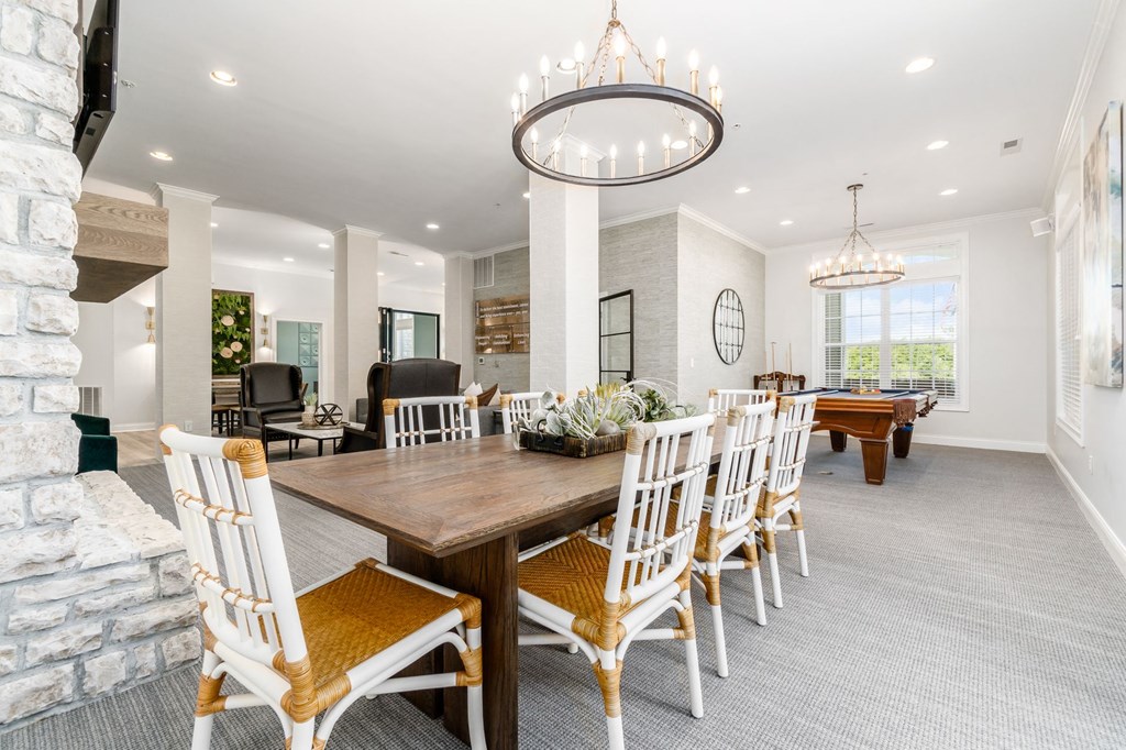 a dining room with a table and chairs and a fireplace
