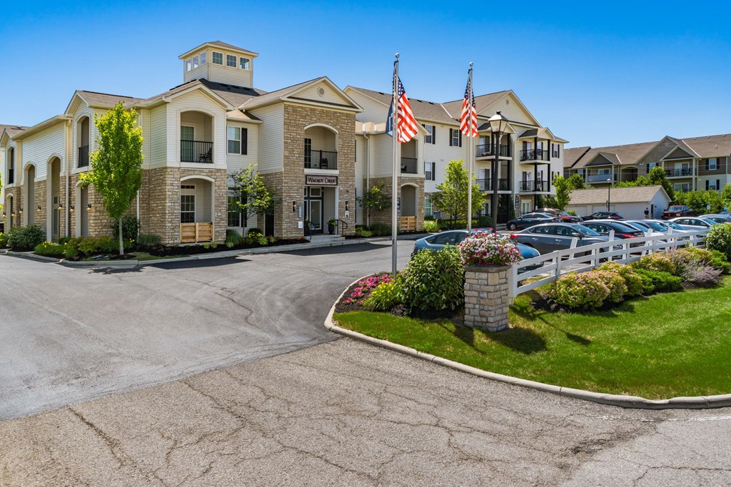 the preserve at ballantyne commons exterior view of apartments with flags