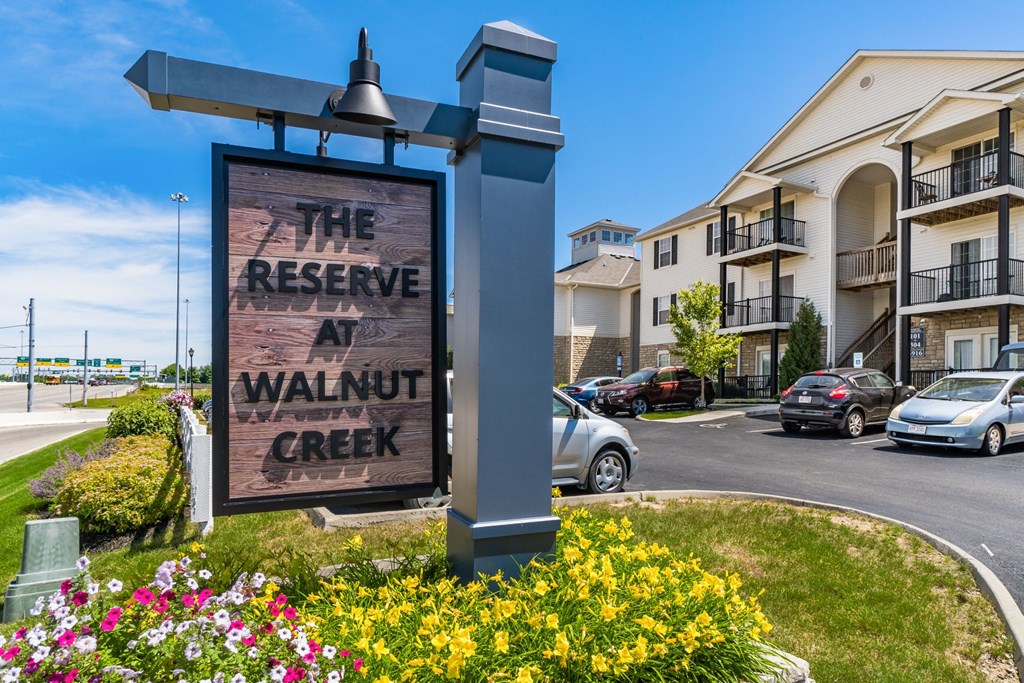 the reserve sign in front of apartments
