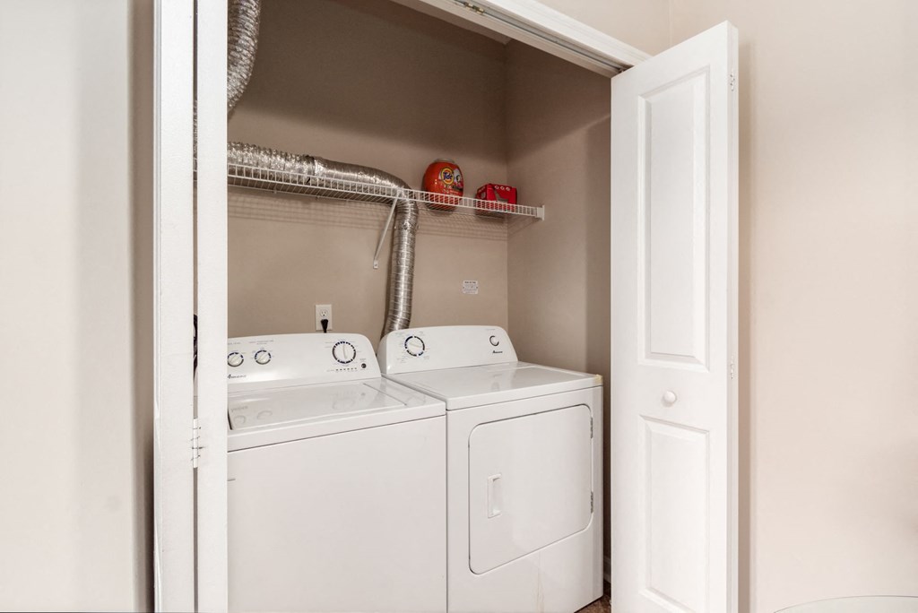 the washer and dryer in the laundry room of a home
