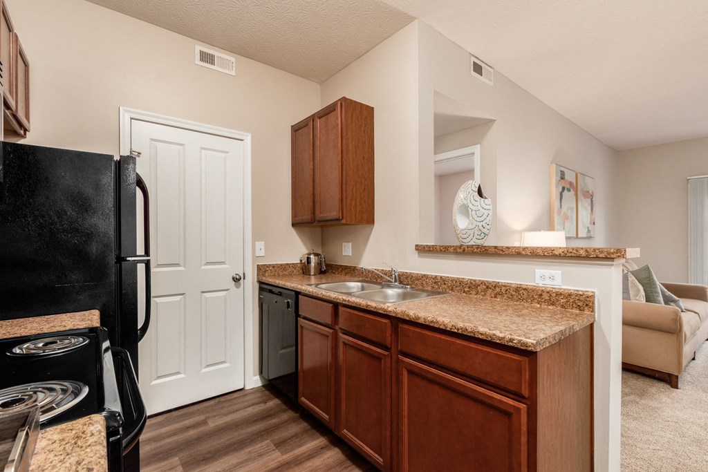our apartments offer a kitchen with a refrigerator and a sink