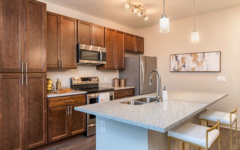 a kitchen with a counter top and a sink