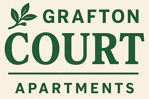 A green and white sign that says Grafton Court Apartments.