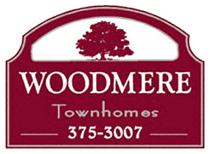 Woodmere Townhomes logo