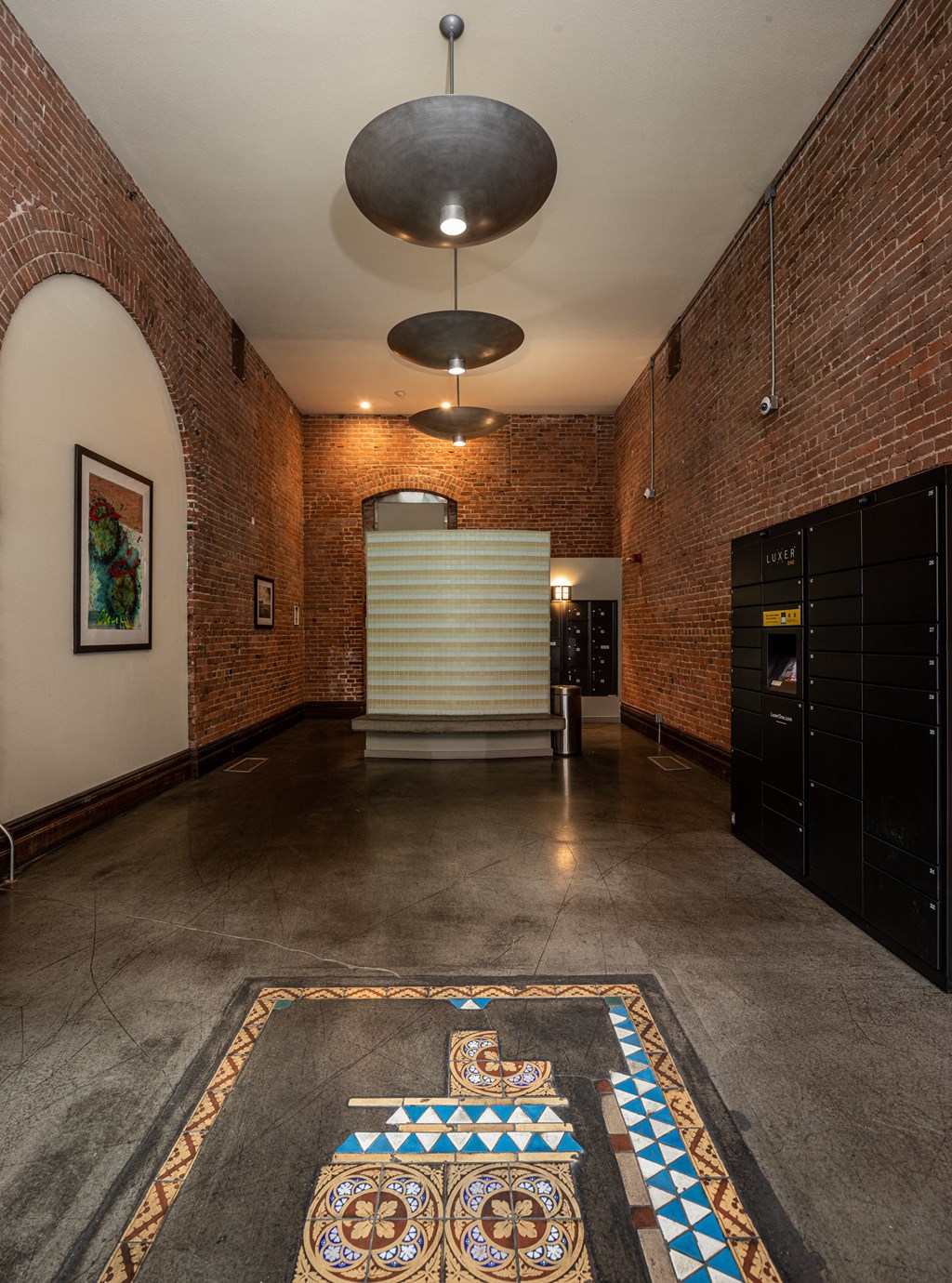 a large room with brick walls and a large rug on the floor