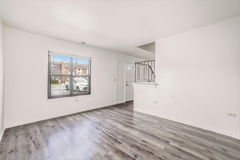 A room with a window and a door.