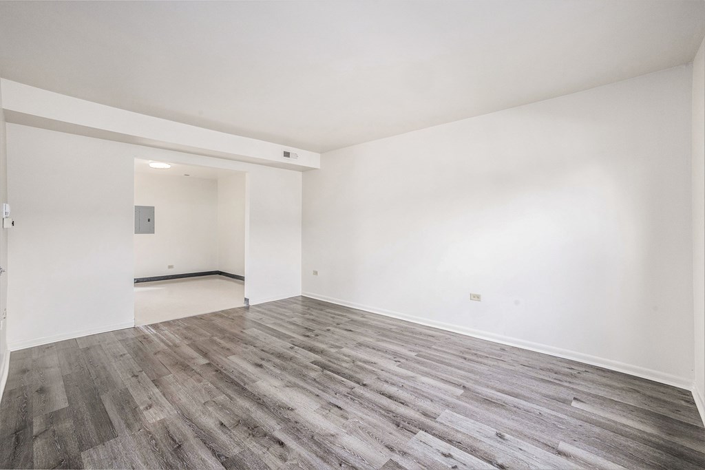 A room with a grey floor and white walls.