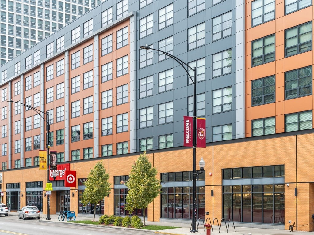 a rendering of a large building on a city street