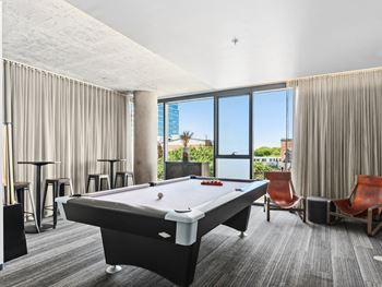 a room with a pool table in the middle at One 333, Chicago, 60605