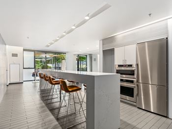 a kitchen with a large island and stainless steel appliances at One 333, Chicago, IL, 60605