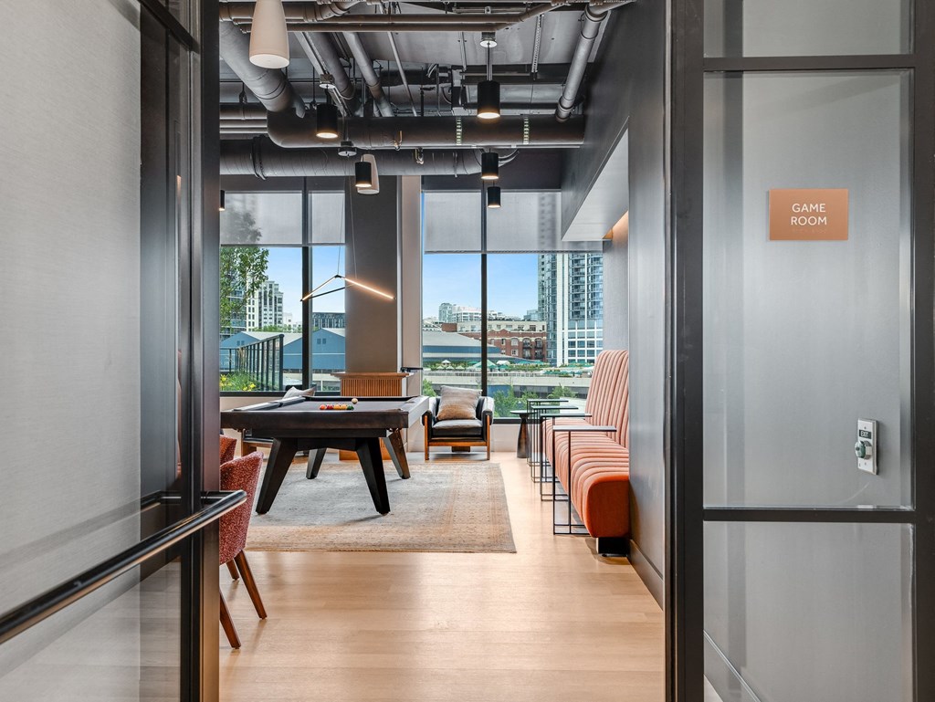 a conference room with a table and chairs and a view of the city  at Cassidy on Canal, Chicago, Illinois