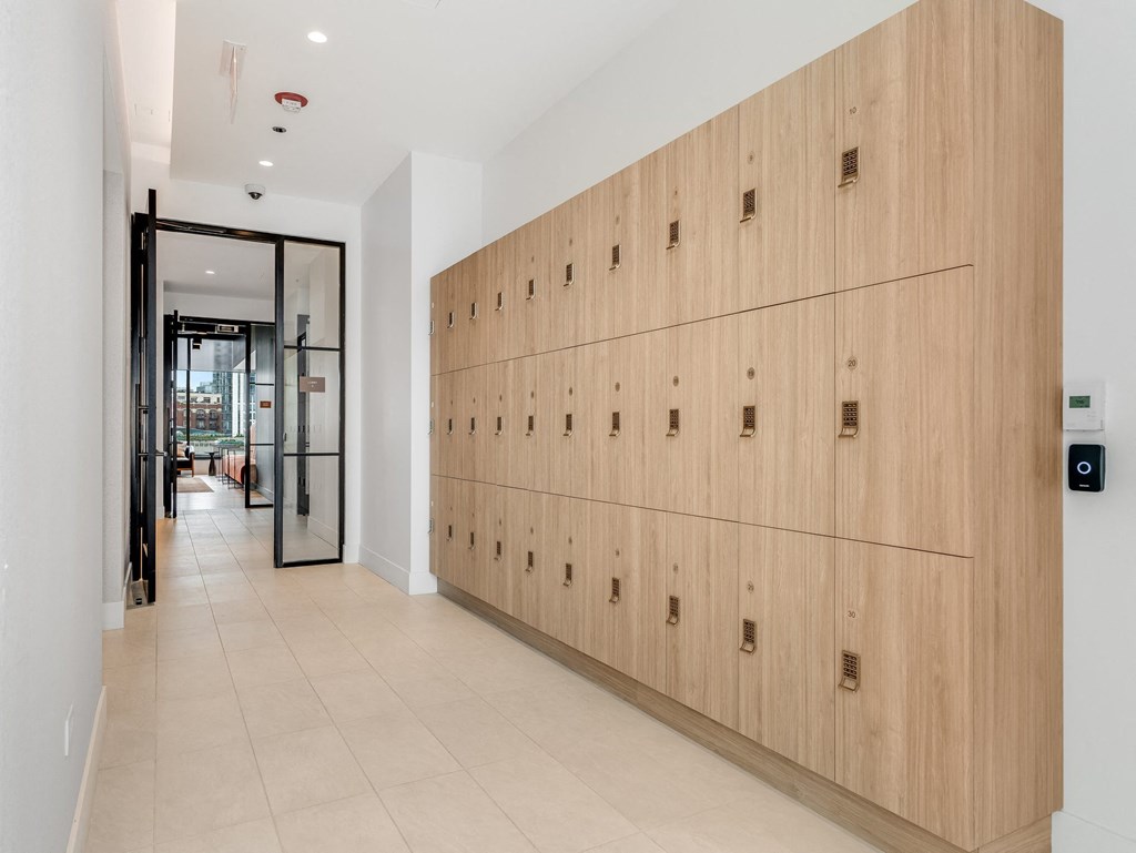 a long row of wooden lockers in a hallway of a building  at Cassidy on Canal, Chicago