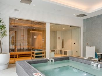 a spa with a jacuzzi tub in a room with a large window  at Cassidy on Canal, Chicago, 60606