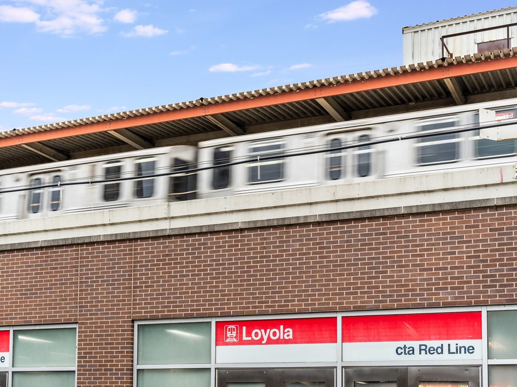 a train is passing by a store