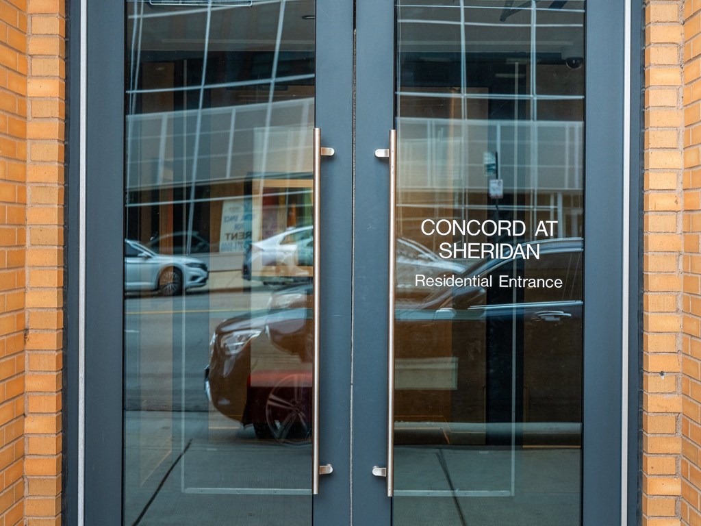 the entrance to the concord with cars reflected in