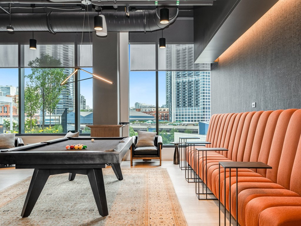a living room with a pool table and chairs  at Cassidy on Canal, Illinois