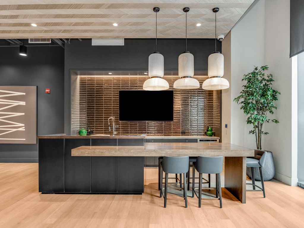 a kitchen with a large island and a table with chairs  at Cassidy on Canal, Chicago