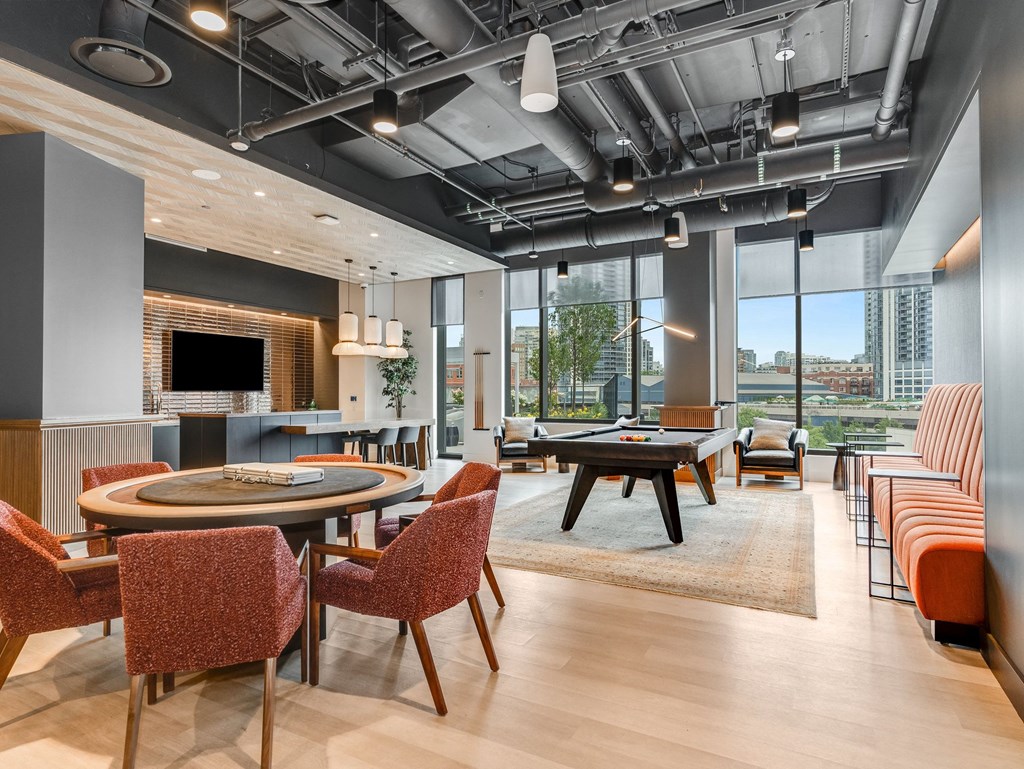 a lounge area with tables and chairs and a pool table  at Cassidy on Canal, Chicago
