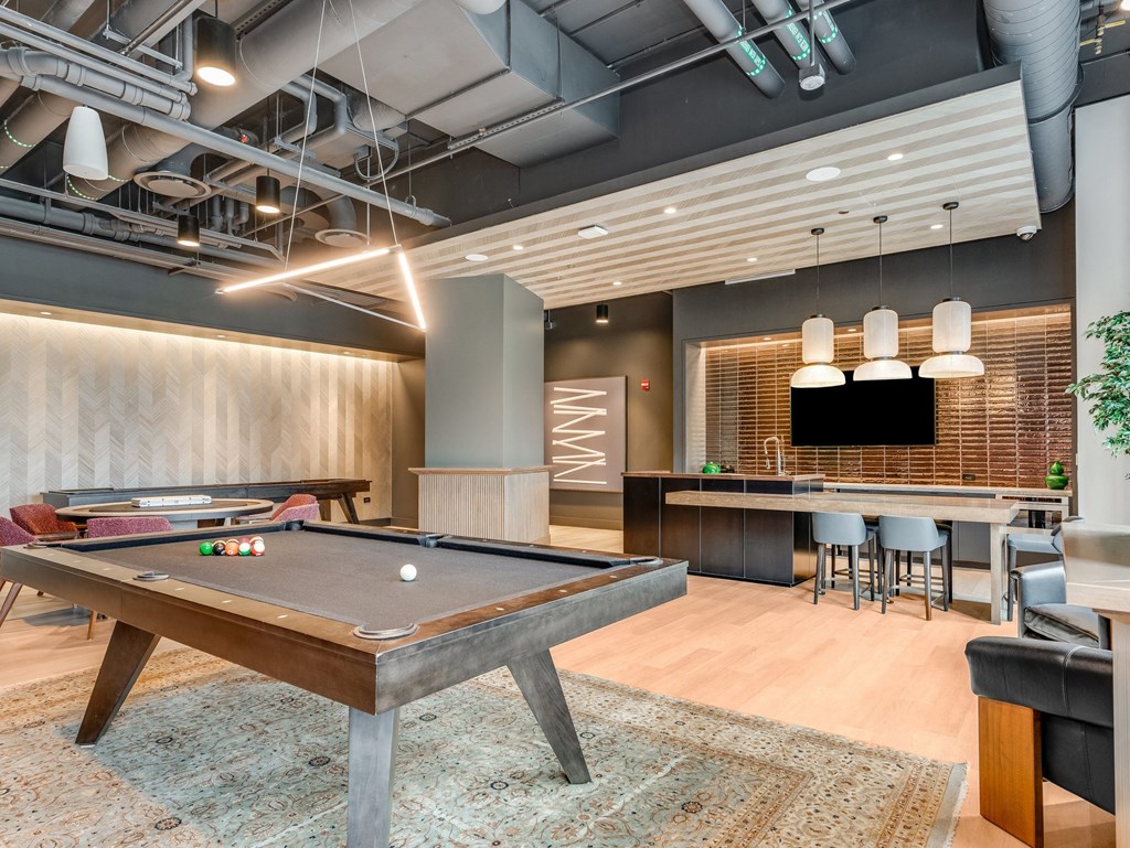 a game room with a pool table and a bar  at Cassidy on Canal, Chicago, Illinois