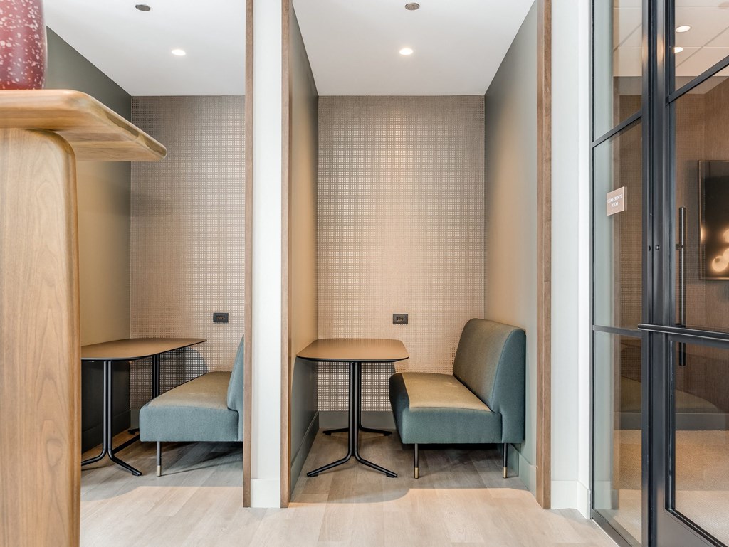 a waiting room with two chairs and a table at Cassidy on Canal, Chicago, IL, 60654