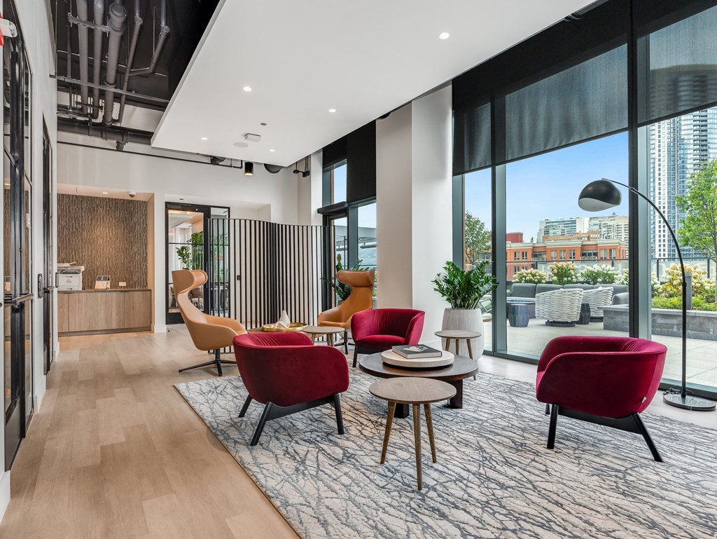 a living room with red chairs and a rug and a  at Cassidy on Canal, Illinois