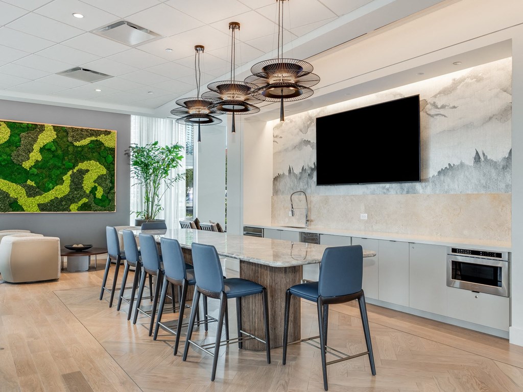 the lobby of a hotel with a bar with blue chairs  at Cassidy on Canal, Chicago, IL