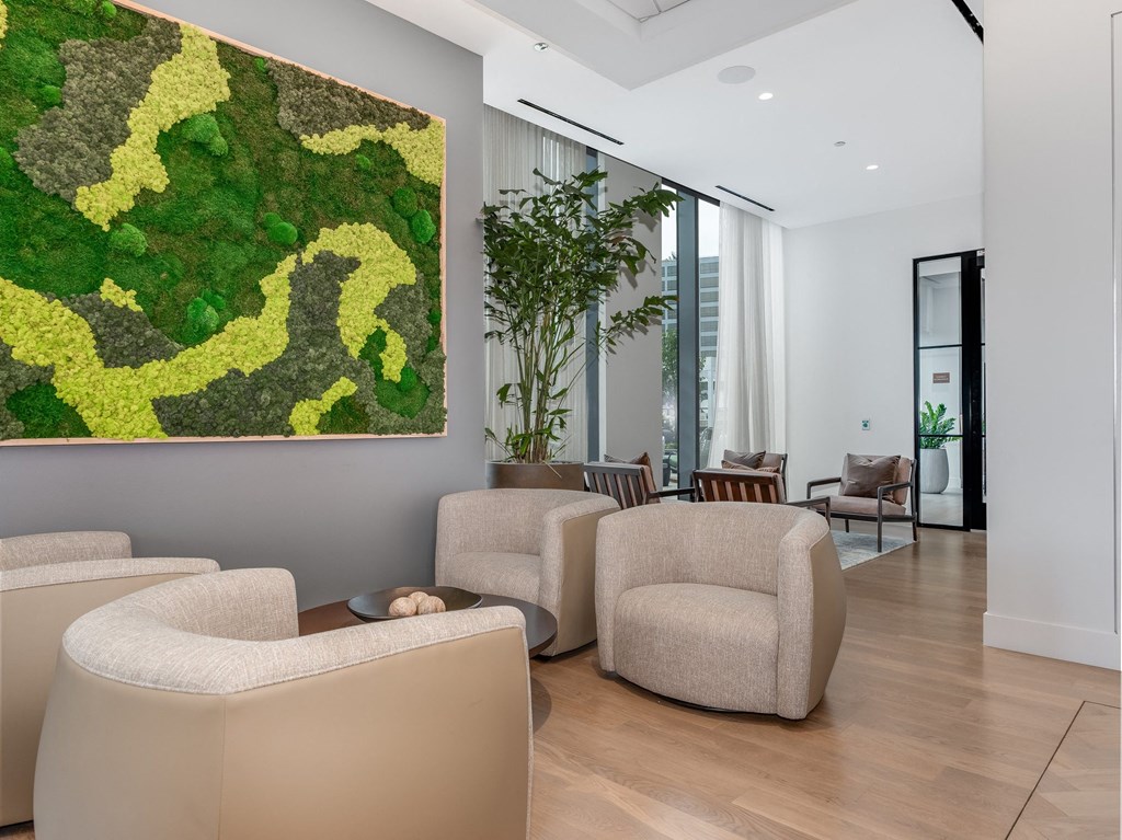 a living room with couches and chairs and a large artwork on the wall  at Cassidy on Canal, Chicago, Illinois