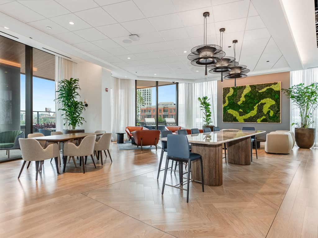 a dining room with tables and chairs and a large window  at Cassidy on Canal, Chicago, Illinois
