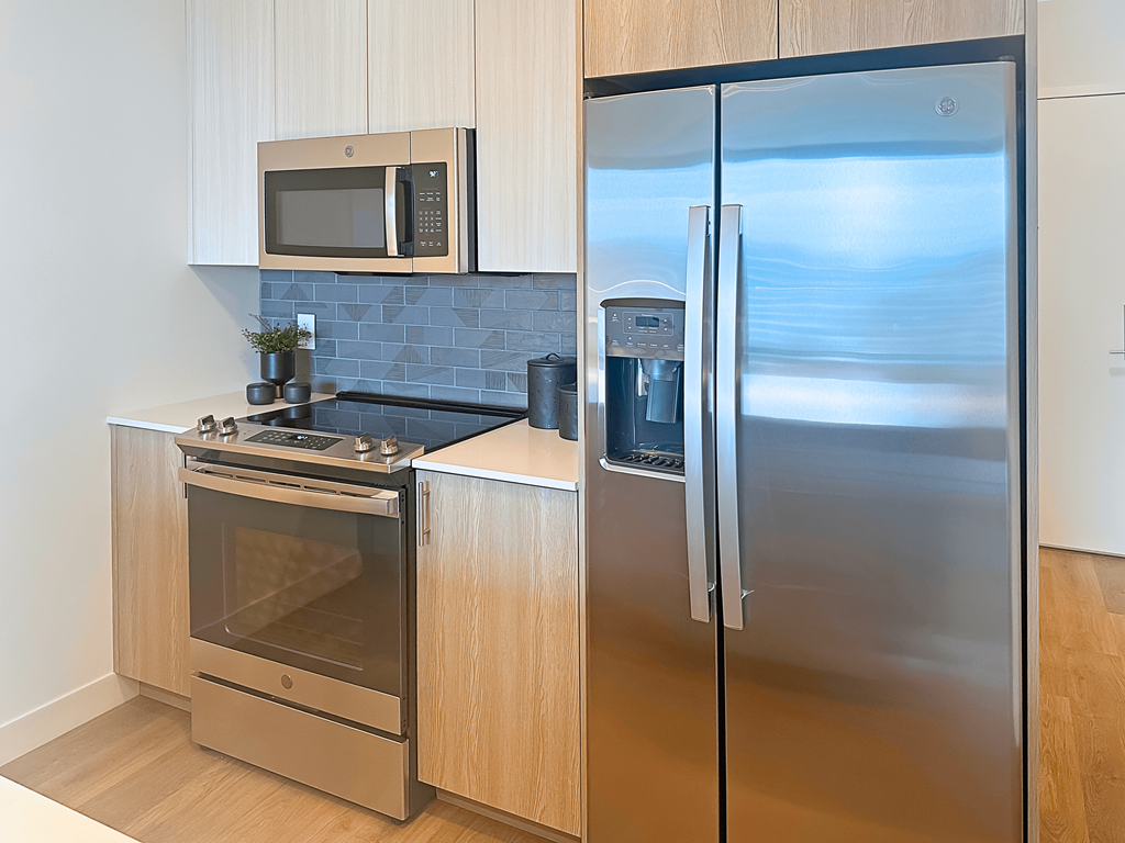 a kitchen with stainless steel appliances and a stainless steel refrigerator at Cassidy on Canal, Chicago