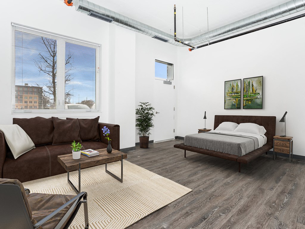 a living room with a couch and a bed