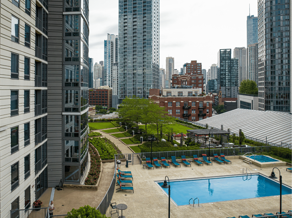 An aerial view of Kingsbury Plazas outdoor elevated pool deck with a view of the city at Kingsbury Plaza, Illinois