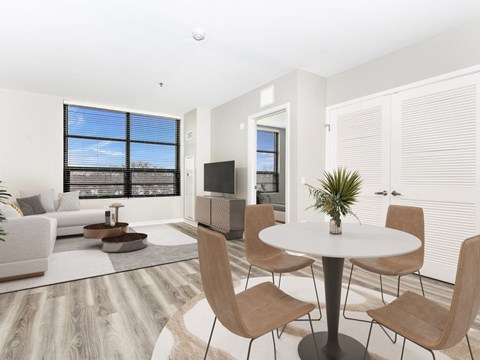 a living room with a couch and a table and a tv