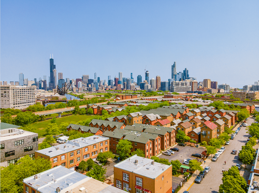 an aerial view of chicago with the chicago skyline in the background
