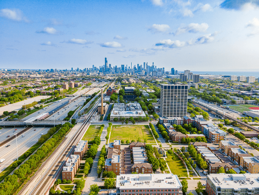 an aerial view of chicago with the city skyline in the background