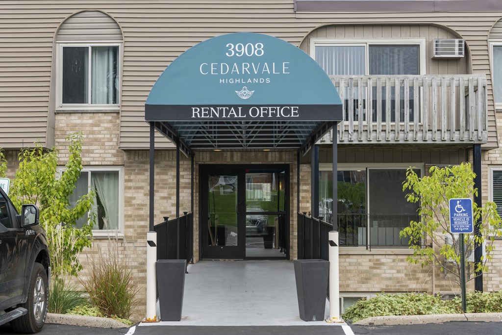 The front of a building with a sign that says