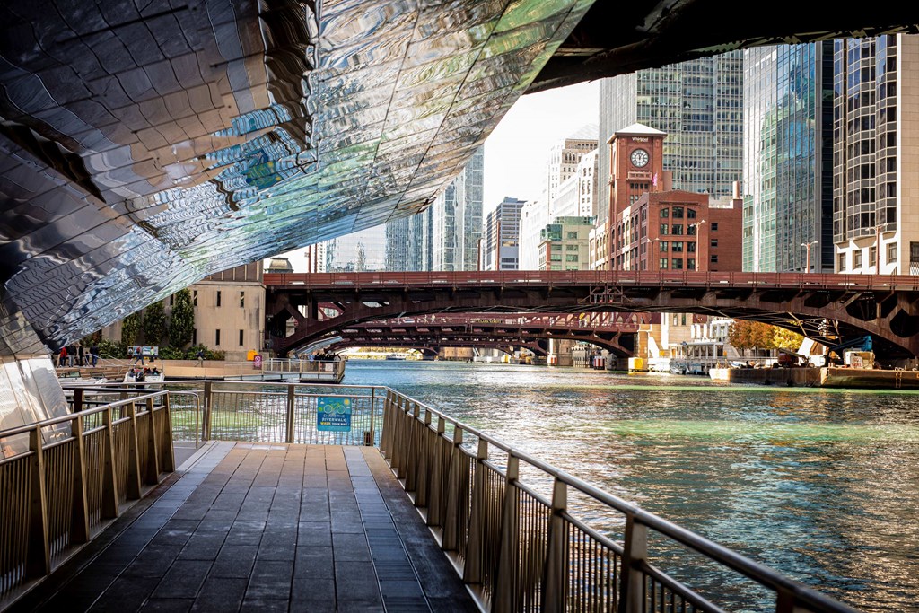 a bridge over the river in a city with skyscrapers at Columbus Plaza, Illinois, 60601