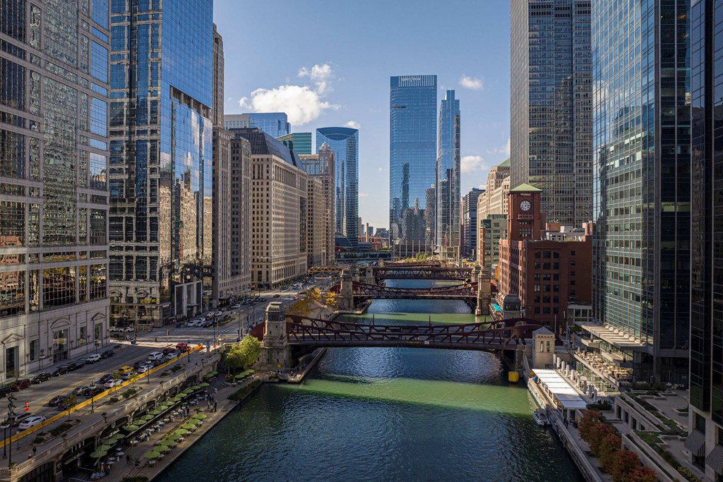 a view of the river with a bridge and skyscrapers at Columbus Plaza, Chicago, IL