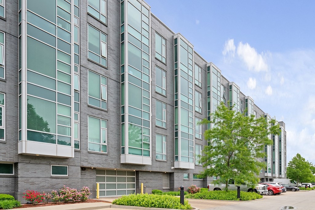 a large apartment building with a street in front of it
