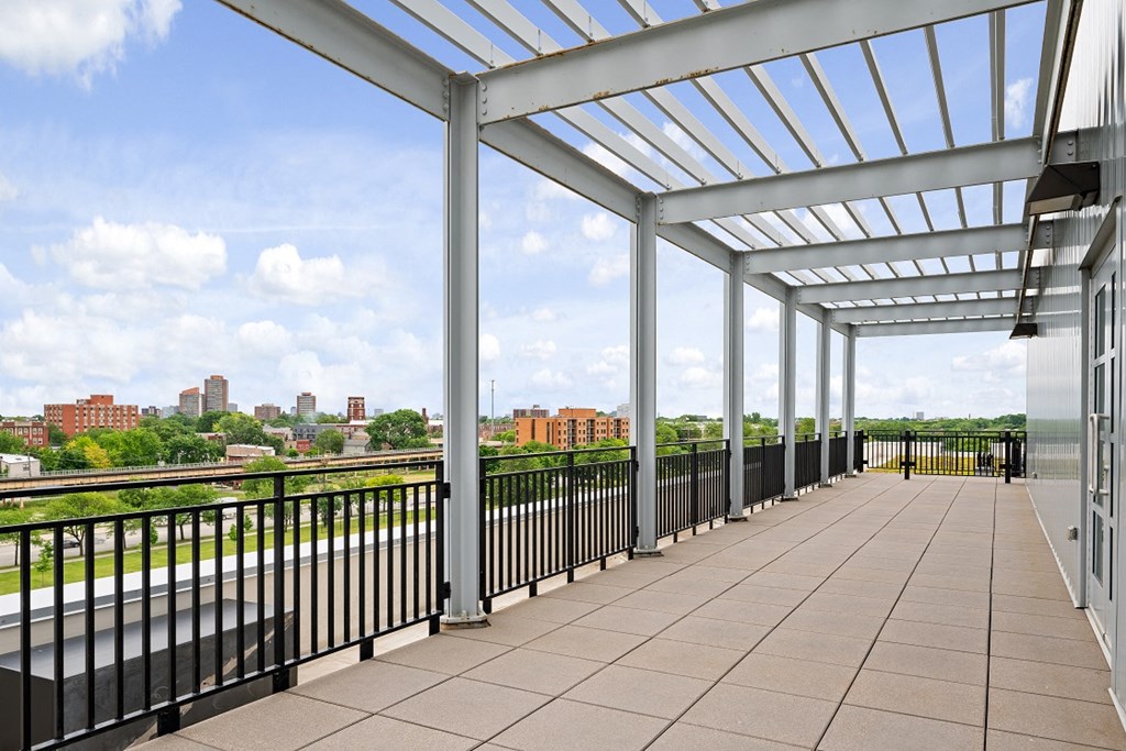 the view of the city from the balcony of a condominium building