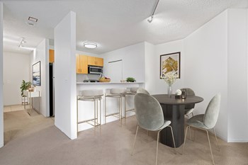 Apartment kitchen featuring a breakfast bar at Asbury Plaza in River North Chicago - Photo Gallery 2