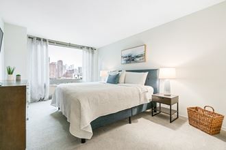 Comfortable Bedroom With Large Window at Elm Street Plaza, Chicago, IL
