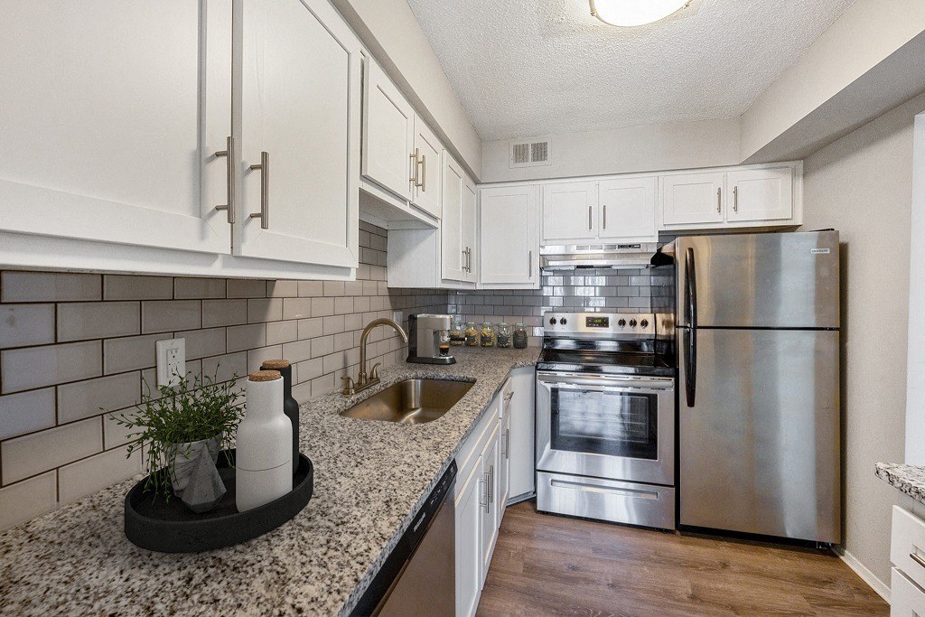 Fully Equipped Kitchen Includes Frost-Free Refrigerator, Electric Range, & Dishwasher at The Waverly, Belleville, MI