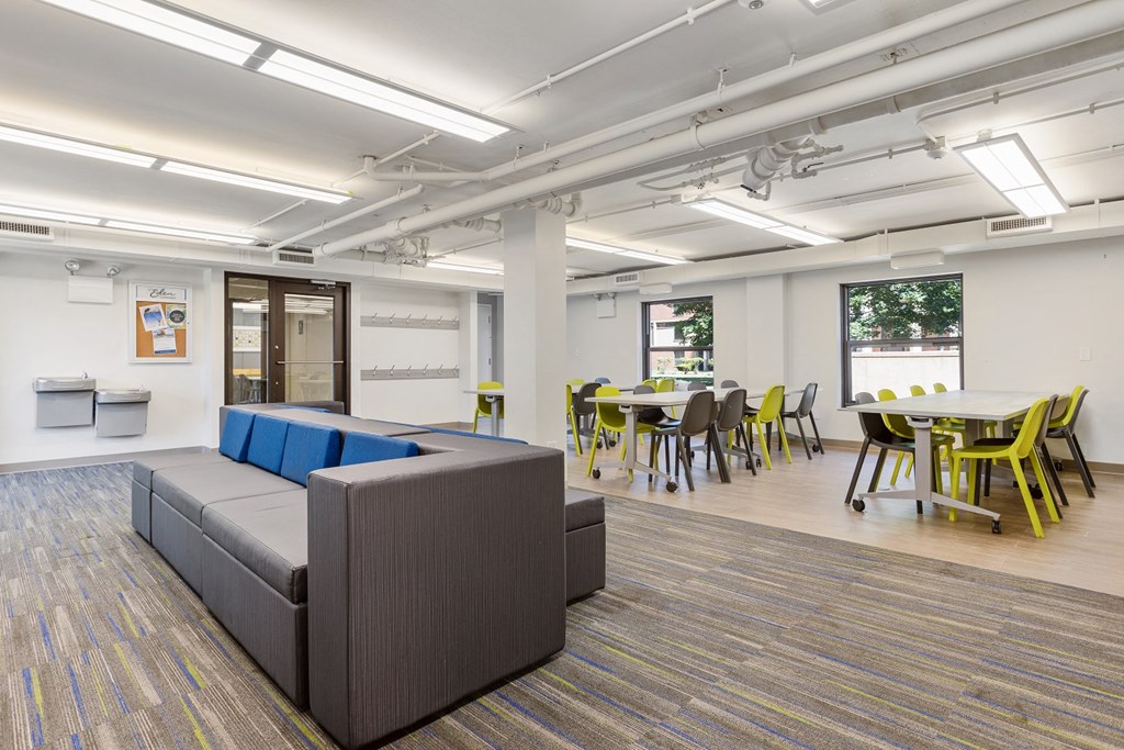 a room filled with furniture and a large window at Eden Commons, Illinois