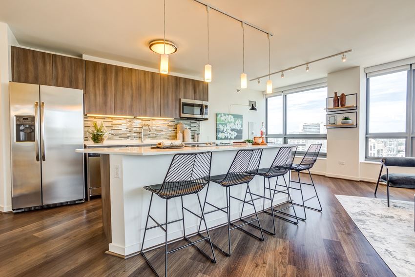 Hubbard Place apartment kitchen with large windows and island in River North Chicago - Photo Gallery 1