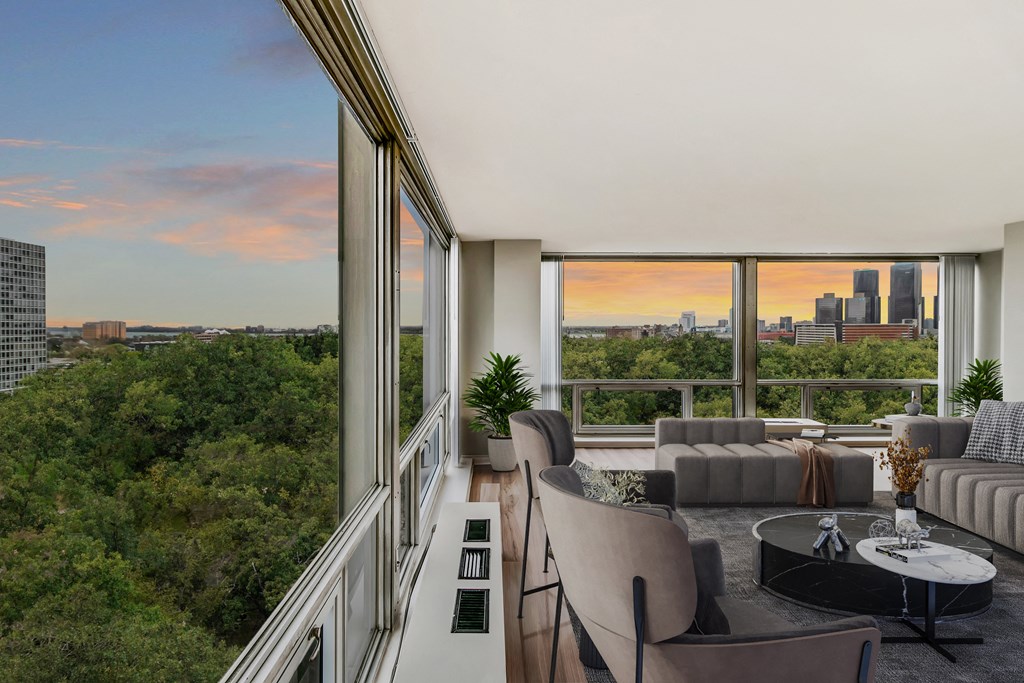 a living room filled with furniture and a large window at The Pavilion, Detroit, MI, 48207