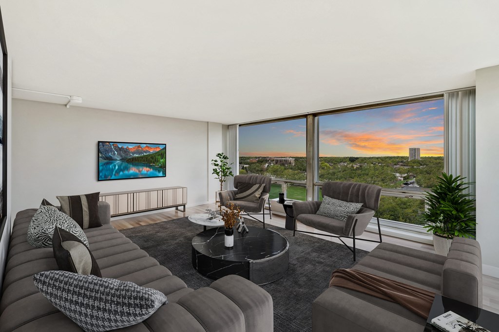 a living room filled with furniture and a large window at The Pavilion, Detroit, 48207