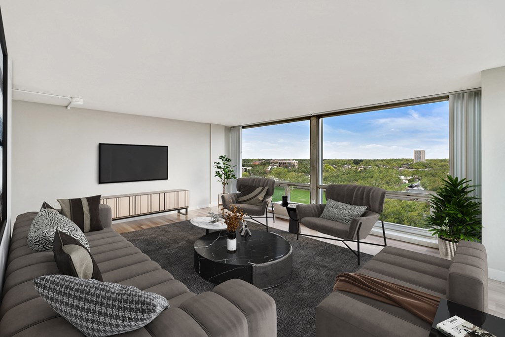 a living room filled with furniture and a large window at The Pavilion, Michigan, 48207