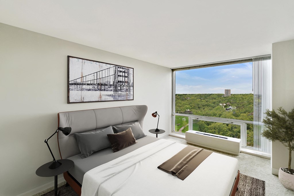 a bedroom with a large bed and a large window at The Pavilion, Michigan