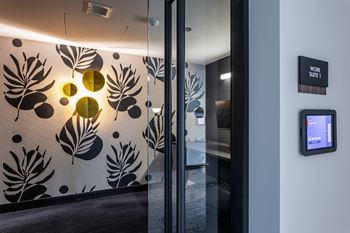 A wall with a leaf pattern and circles on it at Kingsbury Plaza Apartments, Chicago
